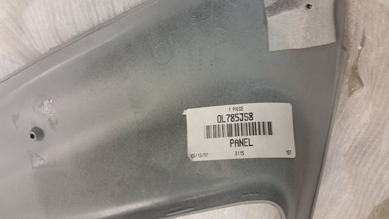 Silver panel with part number OL785JS8 and date 05/15/97