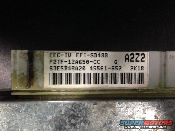 Close-up of an EEC-IV EFI-SD48B computer module with part number F2TF-12A650-CC and barcode