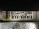 1993 Ford Bronco - This is a close-up view of a vehicle's electronic control module, showing its part number and barcode.