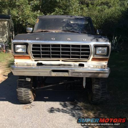 1979 Ford Bronco front view, lifted, with large tires and a chrome bumper