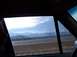1990 Ford Bronco - Driving through a mountainous region with a cloudy sky overhead.