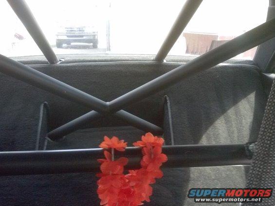 Interior view with roll cage and orange flower garland