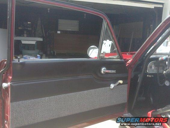 1960 Ford Falcon interior showing door panel, window crank, and dashboard with gauges