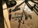 1997 Dodge 3500 - Hardware and parts for a sway bar installation are organized on a cardboard surface.