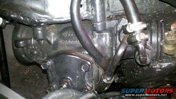 close-up of vehicle's power steering gearbox with hoses attached