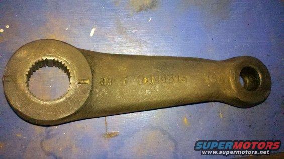 Cast iron steering arm with splined opening and a hole at the other end, marked 'GM T 7320315 10A'