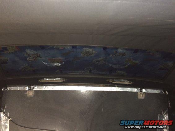 1965 Mustang package tray liner installed with hold down brackets