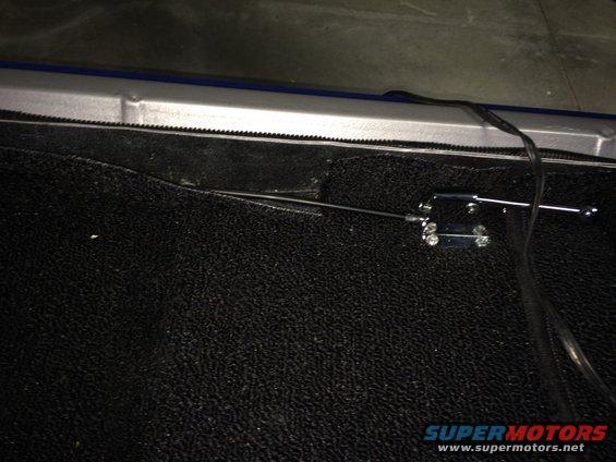 remote-trunk-cable-2-with-carpet-cut.jpg 1965 Mustang Coupe remote trunk release cable