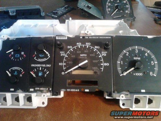 17.jpg got the new speedo in the old assembly.

I am not entirely sure how to change the gauges needle to make them match. I didn't want to risk breaking them