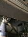 1997 Dodge 3500 - Underside view of a truck's rear suspension system, focusing on the leaf springs and mounting hardware.