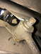 1997 Dodge 3500 - A socket wrench is used to adjust a sway bar link on a vehicle's undercarriage.