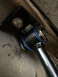 1997 Dodge 3500 - Close-up view of a vehicle's sway bar end link, showing its connection point and bushings.