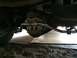 1997 Dodge 3500 - Close-up of a vehicle's rear differential and sway bar, ATS branding on the cover.