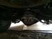 1997 Dodge 3500 - Underside view of a vehicle's rear differential and sway bar assembly.
