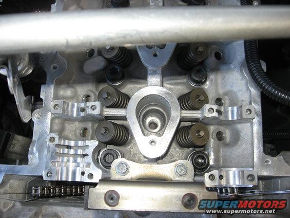 Close-up of engine's valve train with springs and rockers visible