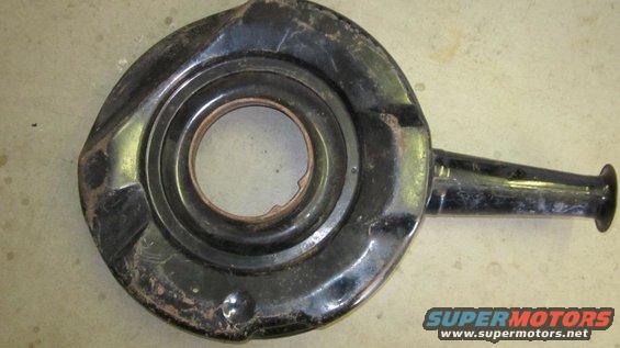 Black metal air cleaner housing with a central opening and a side tube