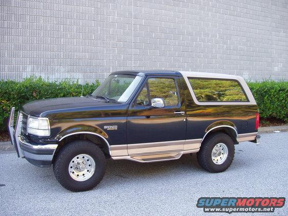 1996 Ford Bronco, dark blue and tan, 3/4 front view