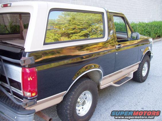 1996 Ford Bronco, two-tone black and tan, with a white removable top