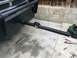 1997 Dodge 3500 - The front of a truck shows a heavy-duty hitch receiver attached to the bumper, with tools laid out on the concrete.