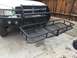 1997 Dodge 3500 - A black hitch rack is mounted to the front bumper of a white 1997 Dodge 3500 pickup truck.