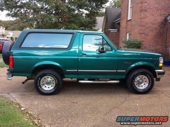 Green 1996 Ford Bronco XLT parked on a driveway