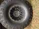 1979 Ford Bronco - Close-up of a large off-road tire and wheel assembly.