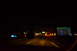 2003 Ford Taurus - Driving on a highway at night, with a GPS navigation system visible on the dashboard.