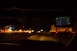2003 Ford Taurus - Driving on the highway at night with traffic visible and a GPS navigation system active.