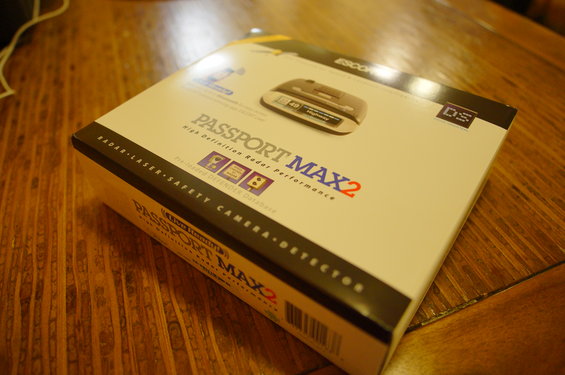 Escort Passport Max2 radar detector box on a wooden table