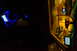 2003 Ford Taurus - A nighttime view inside a vehicle shows a phone and GPS device, with ambient blue light illuminating the console.