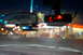 2003 Ford Taurus - A radar detector and rearview mirror are visible inside a vehicle at night, with blurred city lights in the background.
