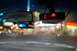 2003 Ford Taurus - Interior view of a radar detector and rearview mirror with blurred background lights.