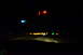 2003 Ford Taurus - Nighttime driving scene from inside a vehicle, with illuminated dashboard elements and distant road lights visible.