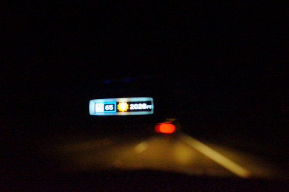 Car dashboard shows 65 degrees and 2020 miles
