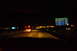 2003 Ford Taurus - Driving at night with GPS navigation visible on the dashboard screen.