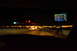 2003 Ford Taurus - The view from inside a vehicle at night, with a GPS displaying navigation information.