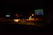 2003 Ford Taurus - Nighttime interior view from a vehicle, displaying a GPS navigation screen with route information.