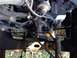 1979 Ford Bronco - Close-up view of engine components including the water pump and drive belts.