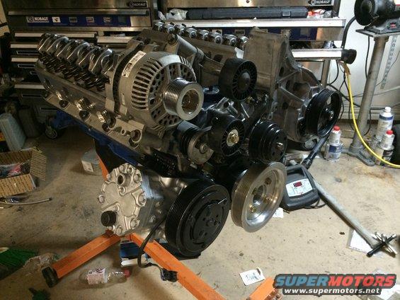 Engine assembly with alternator and air conditioning compressor