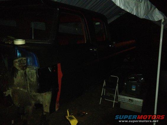 1971 Ford F-250, dark paint, undergoing repairs