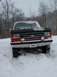 1990 Ford Bronco - This 1990 Ford Bronco is stuck in the snow, with its front end partially buried.