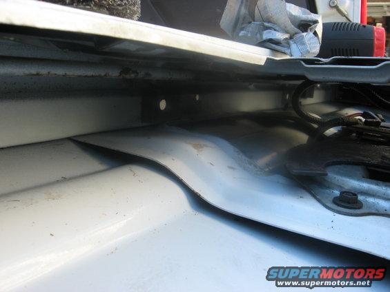 close-up of the metal structure inside a vehicle, possibly near the tailgate area
