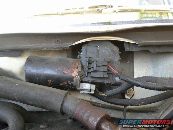 Windshield wiper motor assembly with rust and exposed wires