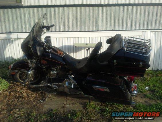 Black Harley-Davidson Electra Glide motorcycle parked outdoors