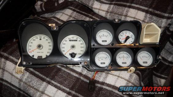Instrument cluster with tachometer, speedometer, fuel, oil, and temperature gauges