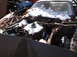 1974 Dodge Challenger - This car is in a junkyard, covered in snow and debris, with its engine exposed.