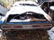 1974 Dodge Challenger - Abandoned 1974 Dodge Challenger sits in the snow, showing its rear end and taillight panel.
