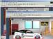 1989 Ford Escort - A digital rendering of a modified Ford Focus ZX3 is shown in a garage setting.