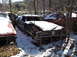 1974 Dodge Challenger - This car is in a junkyard and is covered in snow. Other vehicles are visible in the background.