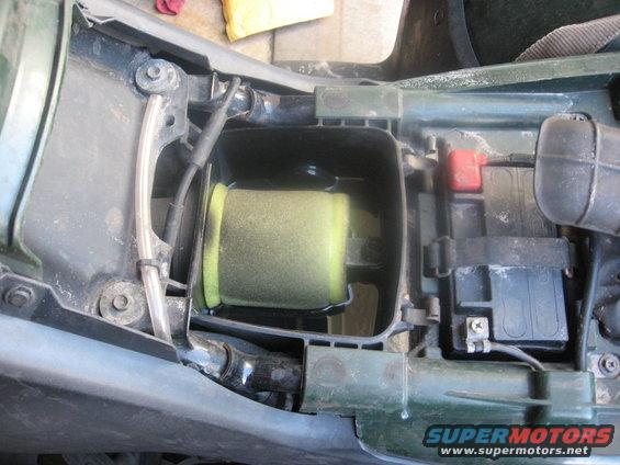 Motorcycle air filter and battery compartment with green housing